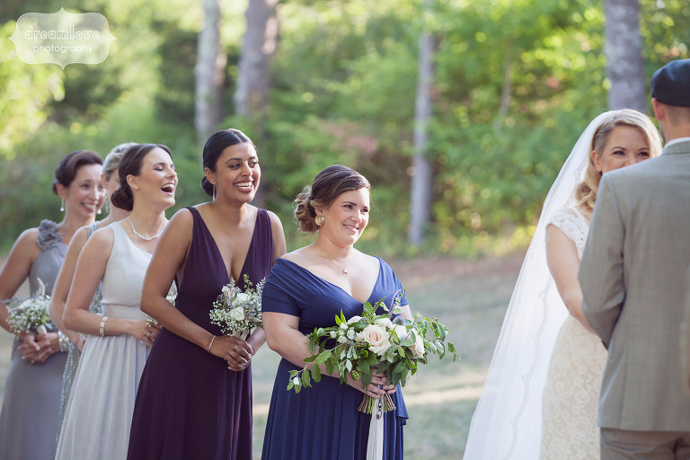 Bridemaids laughing during the outdoor ceremony at the Overbrook House on Cape Cod, MA.