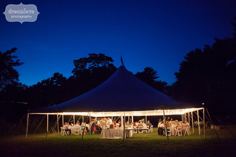Twilight photo of the wedding reception tent at this Cape Cod wedding.