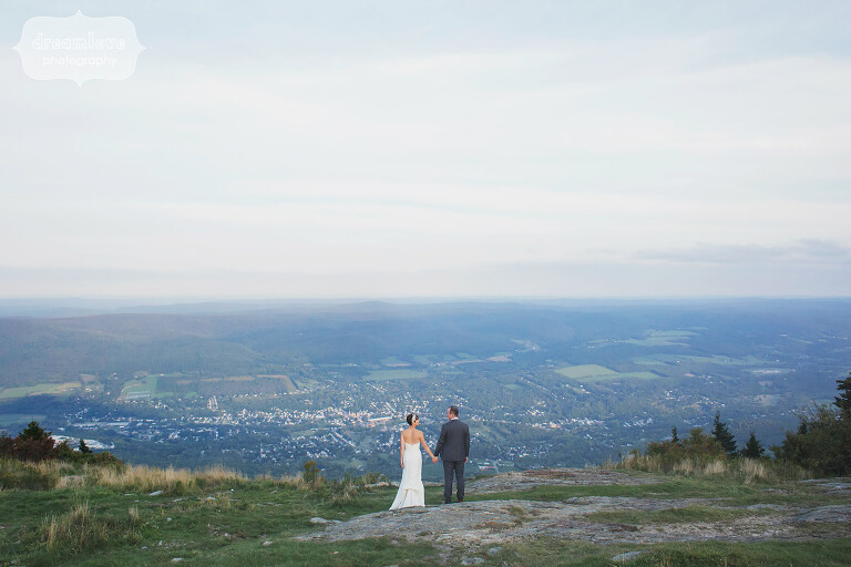 Bride and groom stand on the mountaintop of Mt. Greylock for their Berkshires wedding in western MA.