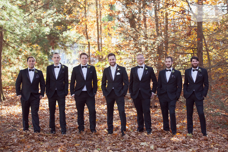 Classy photo of the groomsmen in tuxedos at the Crystal Lake Pavilion wedding.