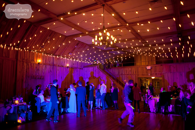 Wedding reception dance floor lighting with string lights above at CT wedding.