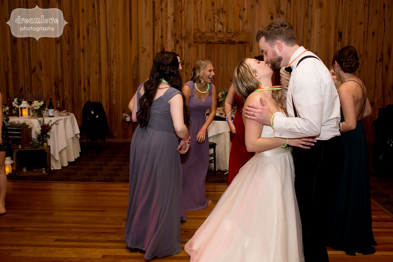 Bride and groom kiss on the dance floor at the Crystal Lake Pavilion reception in CT.