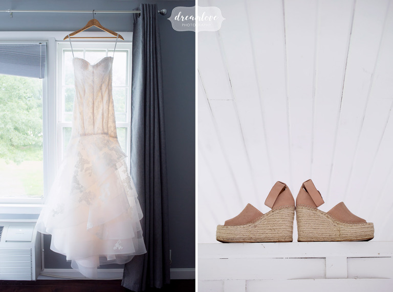 The bride's dress hangs at the Inn on Main in Wolfeboro, NH before her lakes wedding.
