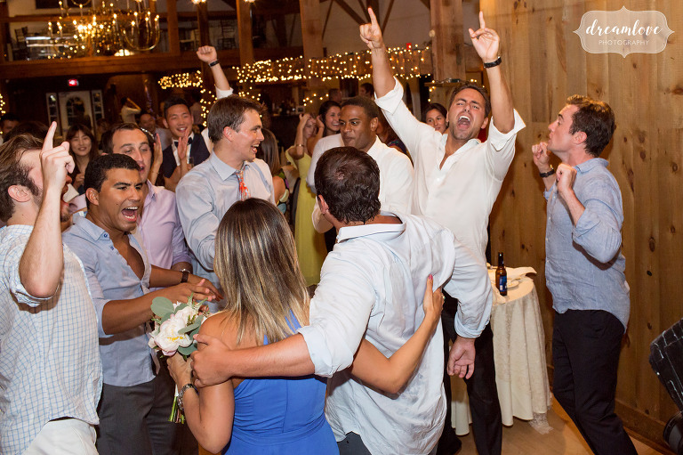 Wild wedding guests carry someone's boyfriend to the dance floor after catching the bouquet in Wolfeboro.