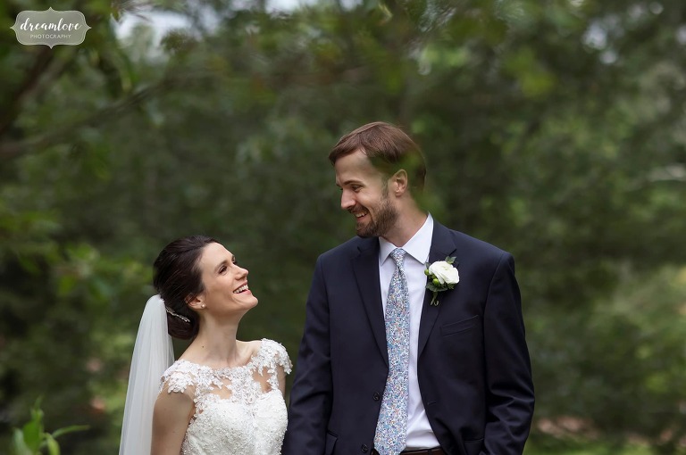Bride and groom smiling at their Moraine Farm summer wedding. 