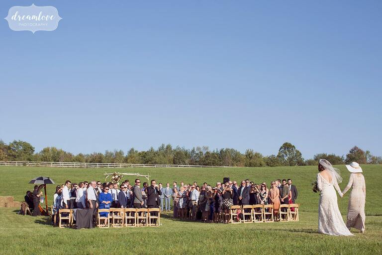 This is what an outdoor ceremony in the field looks like at the Barn at Liberty Farms wedding venue in September.