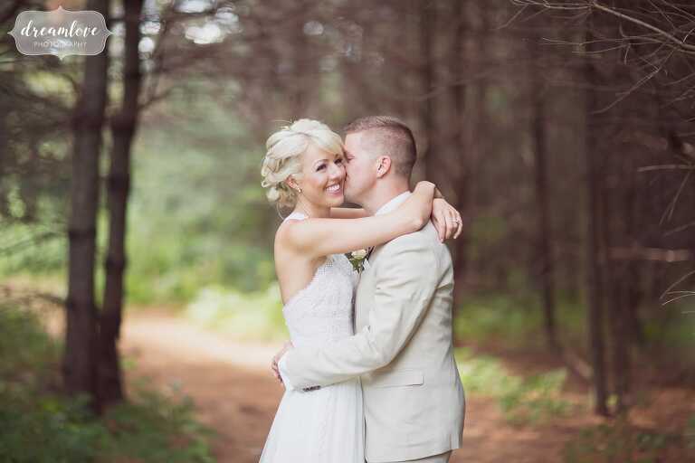 Woodland wedding venue at Bishop Farm in NH with bride and groom in pine forest.