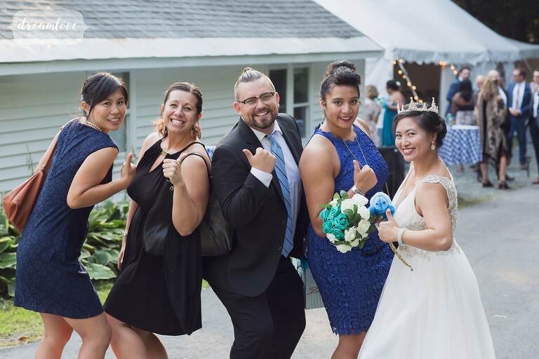 Wedding guests pose for funny photo.