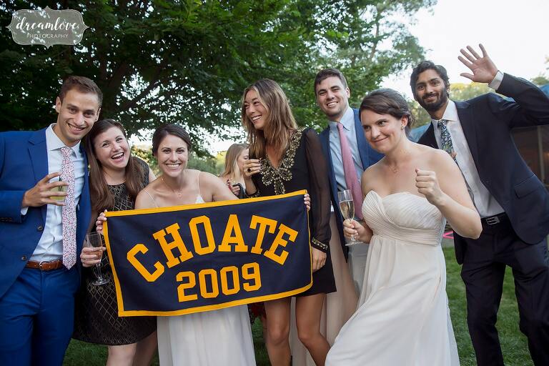 Friends carry the Choate wedding banner flag at Boston wedding.