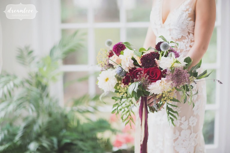 Artistic wedding photographer captures fall bridal bouquet at Linden Place.