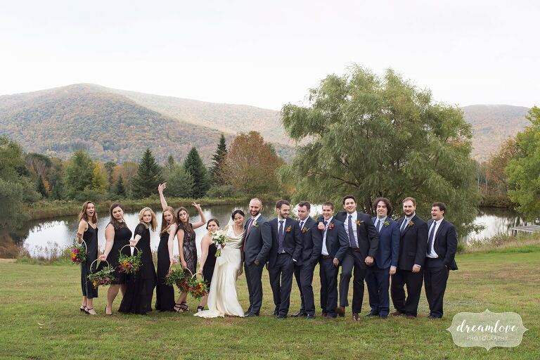 Fun wedding party in front of pond in this Catskills backyard wedding.