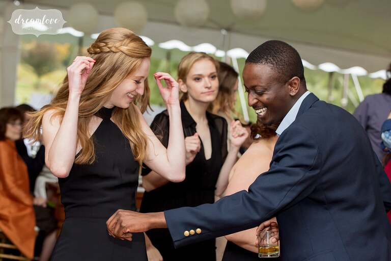 The guests dance under a tent at this Catskills wedding.