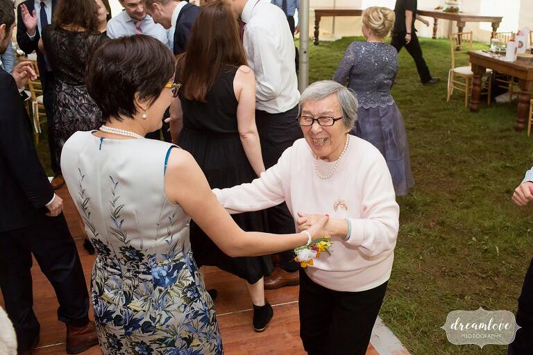 The grandma dances with her daughter at this Catskills wedding.