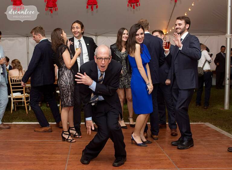 Hilarious old man dancing in front of young people for this Catskills backyard wedding.