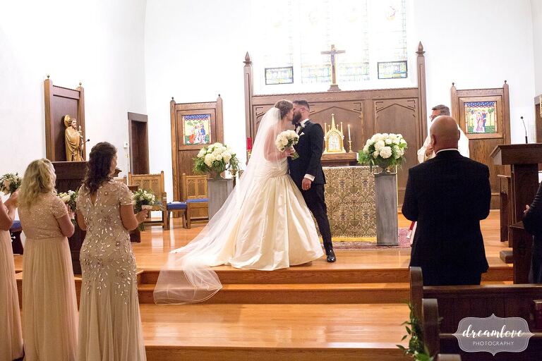 Bride and groom kiss at Windsor, VT church.