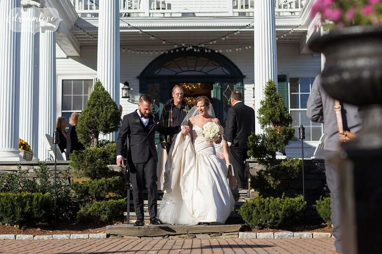 Bride and groom enter the Windsor Mansion reception in VT.