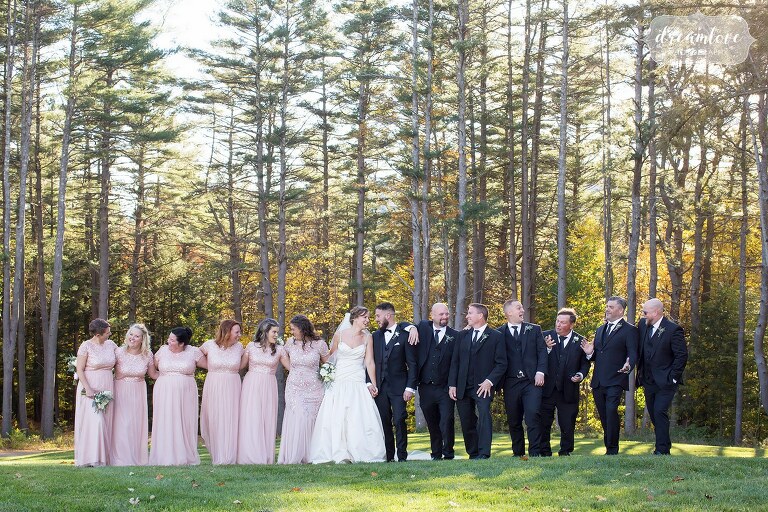 Large wedding party in the field at Windsor Mansion venue in October.