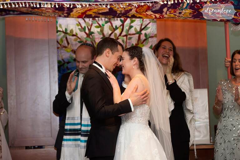 Boston Jewish wedding kiss at Temple Shir Tikva.