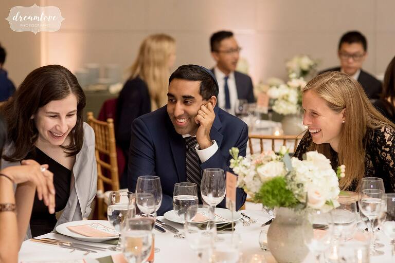Guests laugh together at Temple Shir Tikva reception.