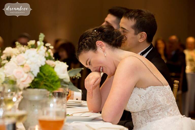 Bride laughs during parent speech at Temple Shir Tikva.