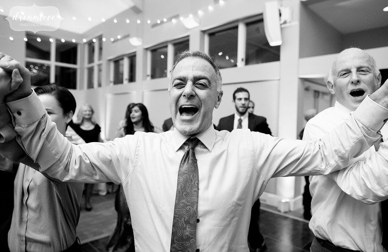 Wild guest dancing at Jewish wedding in Boston.
