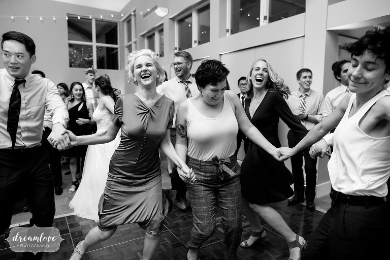 Candid wedding photos of guests dancing at Jewish wedding.