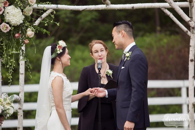 Wedding ceremony with birch arbor.
