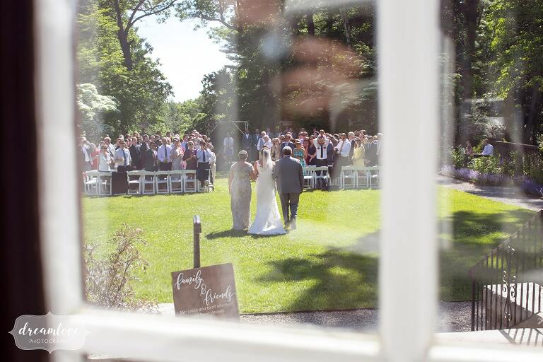 Bride walks into the outdoor garden ceremony at Bradley Estate.