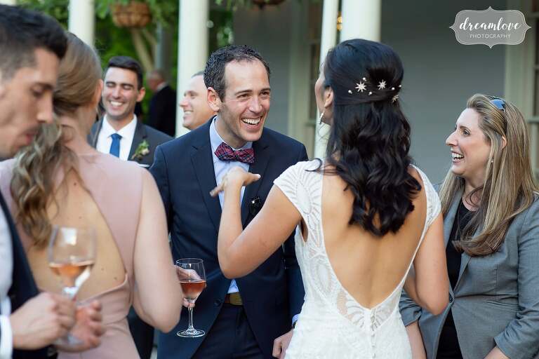 Candid photos of bride mingling with guests at Lyman Estate.