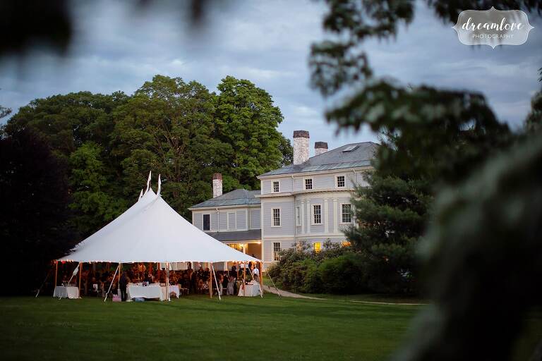 View of Lyman Estate with sailcloth tent set up for June wedding.