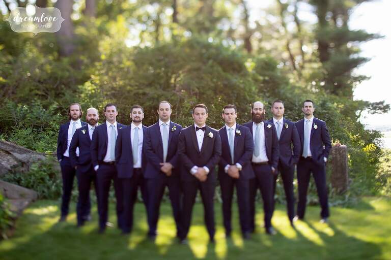 The groomsmen in tuxedos with tilt shift lens at the Crane Estate.