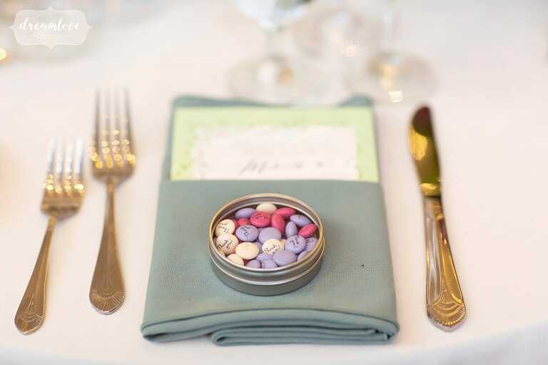 Little tin of candies at wedding place setting.