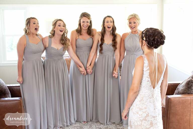 Bridesmaids have emotional reaction to the first look with the bride at the Warfield House.