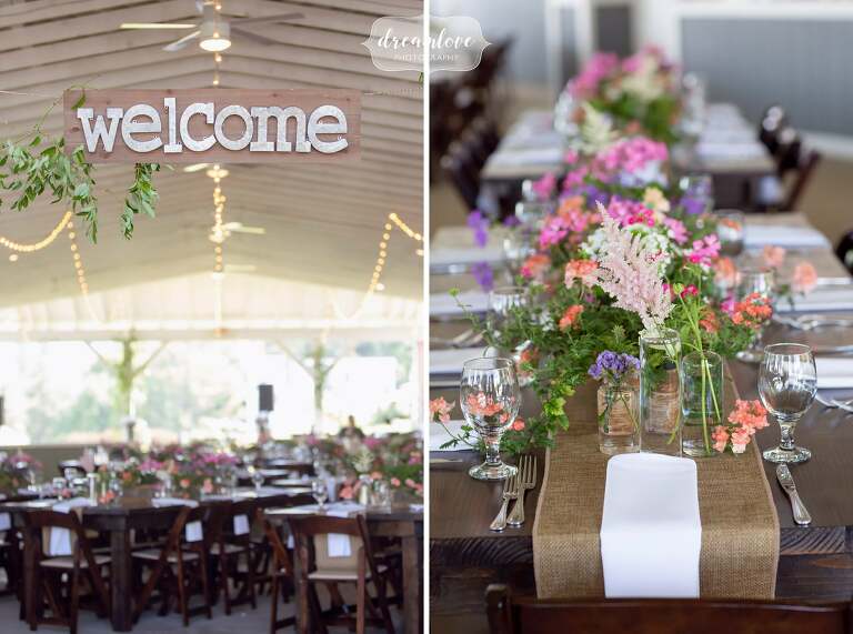 Rustic welcome sign with wildflowers at this Western Mass wedding.