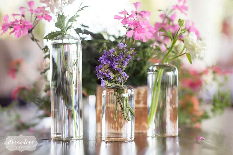 Modern stout vases with wildflowers at this Berkshire East resort wedding.