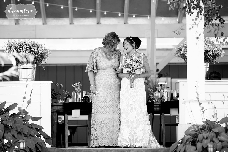 Candid wedding moment of bride and her mother before walking down the aisle.
