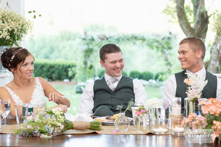 Western Mass documentary wedding photographer captures groom laughing.