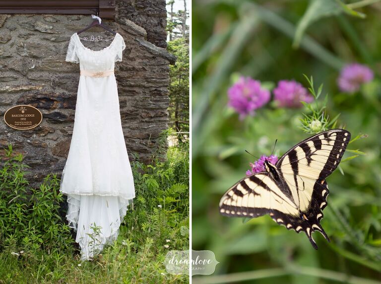 Bride's dress hanging on side of stone lodge at Mt. Greylock.