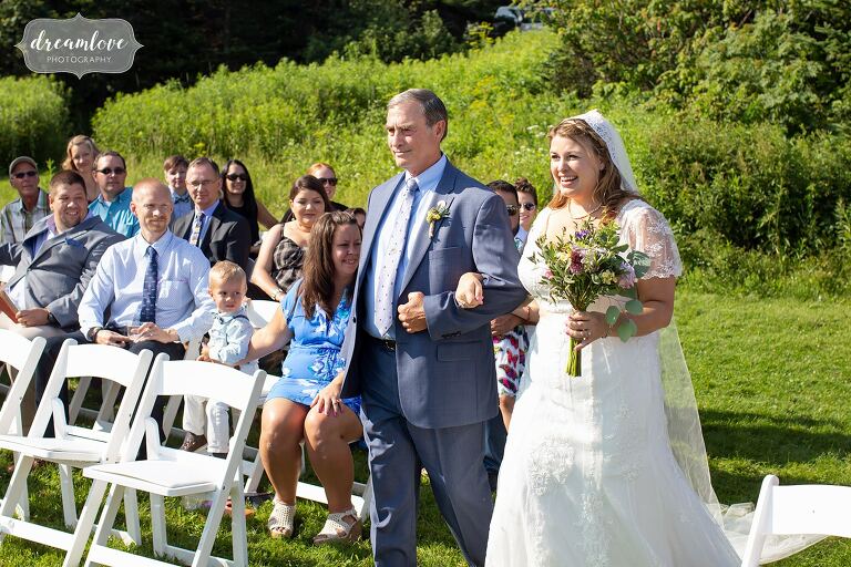 Bride enters outdoor ceremony on top of Mt. Greylock with her father.