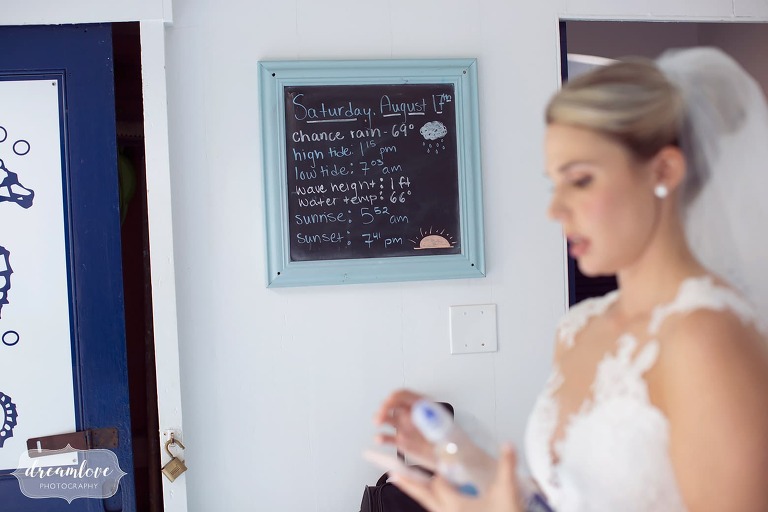 Bride getting ready for the day at the Singing Beach Club locker room.