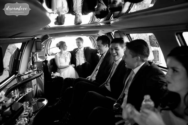 Wedding party rides in a stretch hummer limousine.