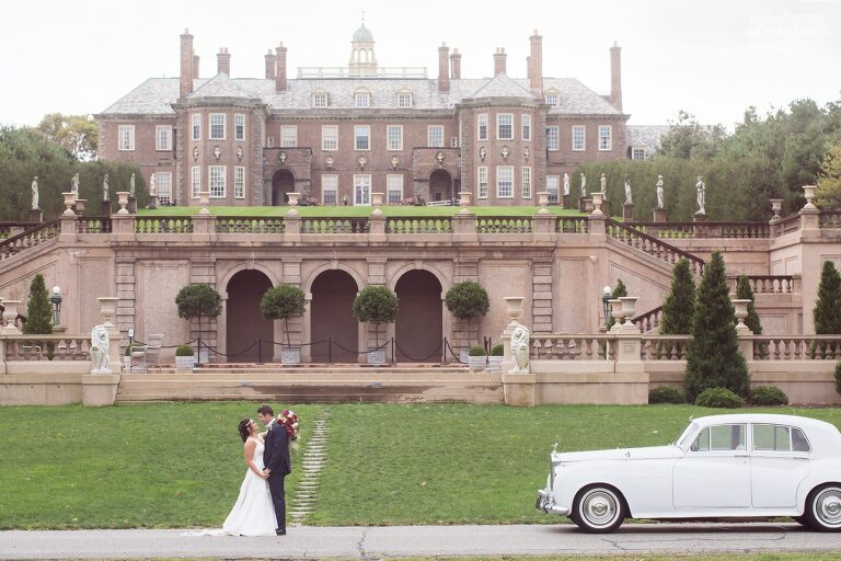 Bride and groom in front of the Castle at Crane Estate wedding venue.