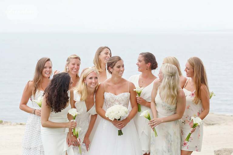 Bridesmaids all in different white dresses in CT.