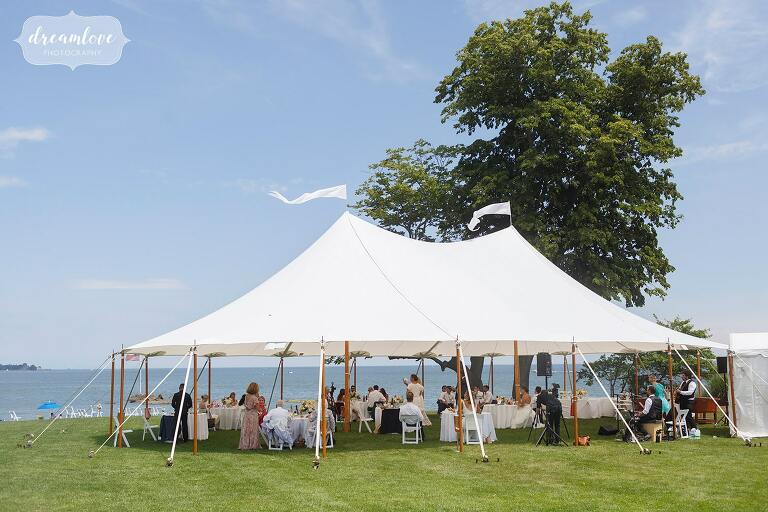 Outdoor covid tented wedding reception at the Woodway Beach Club in Stamford, CT.