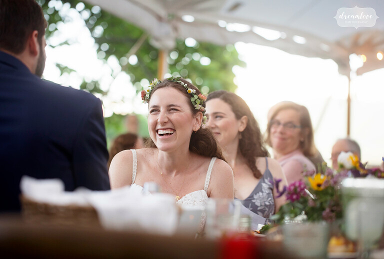 Bride laughing at speeches at Cricket Creek Farm.