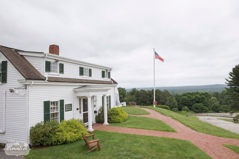 View of the little white house at Fruitlands Museum wedding venue.