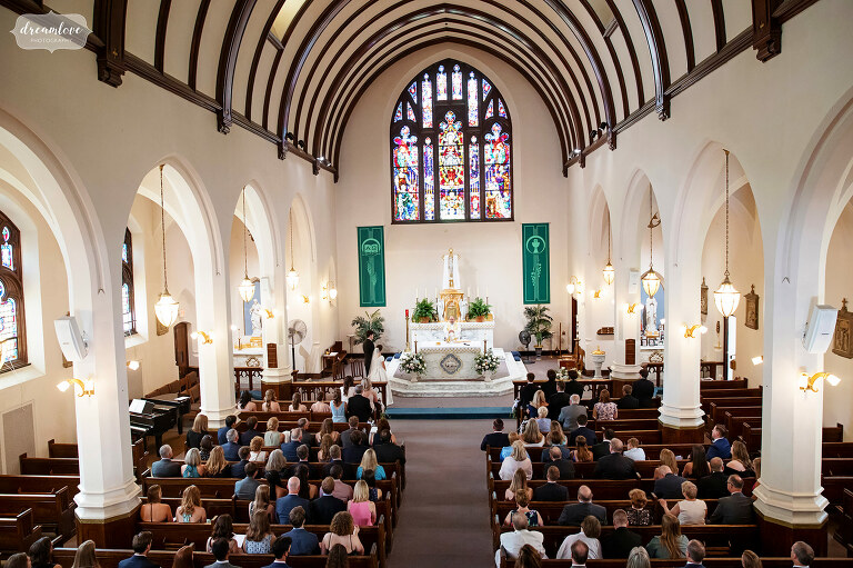 Inside view of Sacred Heart church in Manchester, MA during wedding.