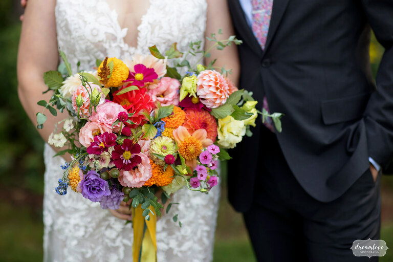 Colorful wedding bouquet held by bride in Franconia, NH.
