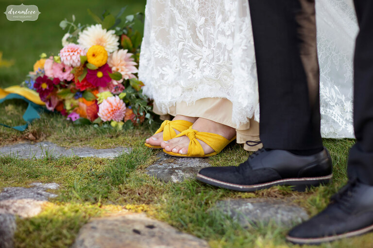 Bride wearing colorful yellow shoes.