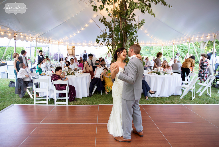 Bride and groom dance under tent at intimate wedding venue in the Berkshires.